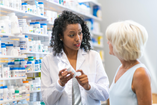 What Are Synthetic Cannabinoids 4 Pharmacist explaining medication safety and health risks to a patient.