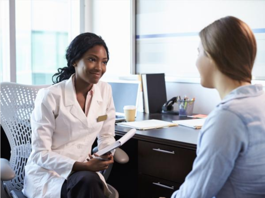 What Are Synthetic Cannabinoids 2 Healthcare professional discussing substance-related health risks with a patient.