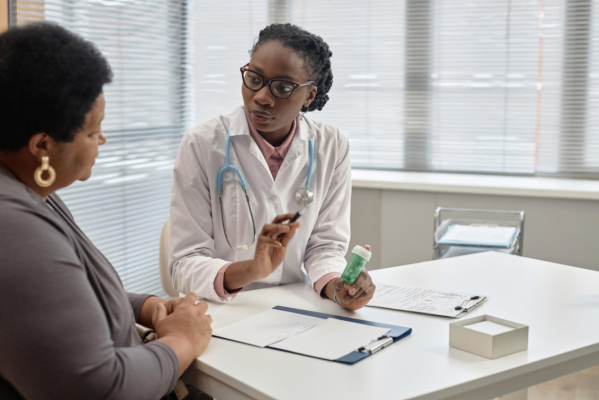 Signs of Drug Poisoning 4 Healthcare professional discussing medication safety with a patient.