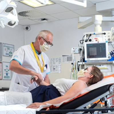 Signs of Drug Poisoning 2 Healthcare professional assessing a patient during an emergency.